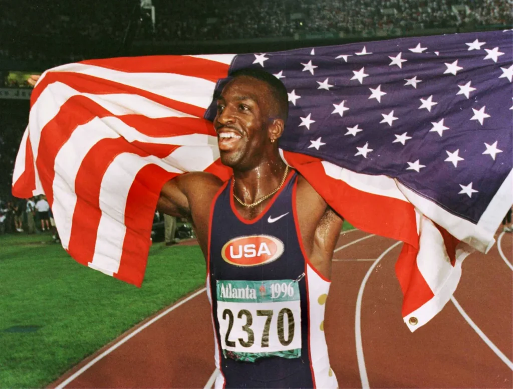 Michael Johnson accused of embezzling $500,000 from indebted athletics league.