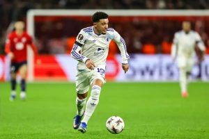 Jadon Sancho raises injury concerns after incident in friendly match.