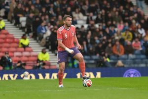 McGinn overcomes injury and secures a spot on the national team for the World Cup.