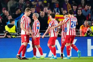 Atletico Madrid surprises Barcelona reduced to 10 at Camp Nou.