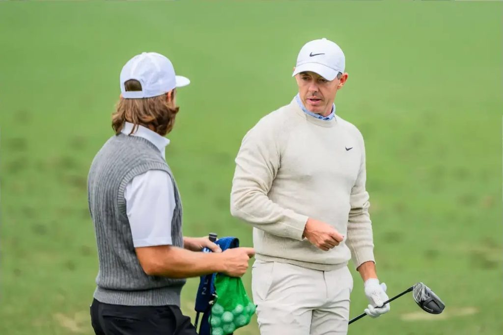 Rory McIlroy honors Tiger Woods at the Masters Champions Dinner.