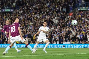 Leeds takes a giant step towards the Premier League with victory over Burnley.