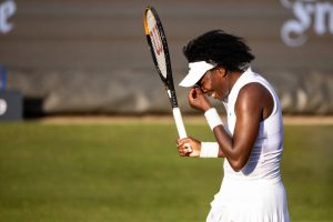 Venus Williams criticized after new defeat and debate over wild cards.