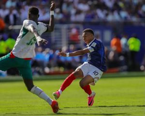“Mbappé makes history in the World Cup with two goals in the victory over Senegal.”
