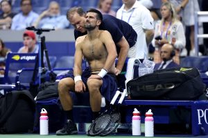 Novak Djokovic suffers shock us open first-round defeat after vomiting on court