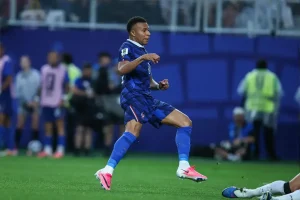 Mbappe’s double sinks Iraq as France storms into World Cup last 32 despite weather delay